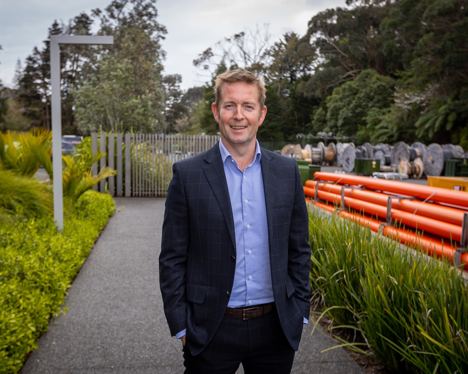 Man in a suit standing outside