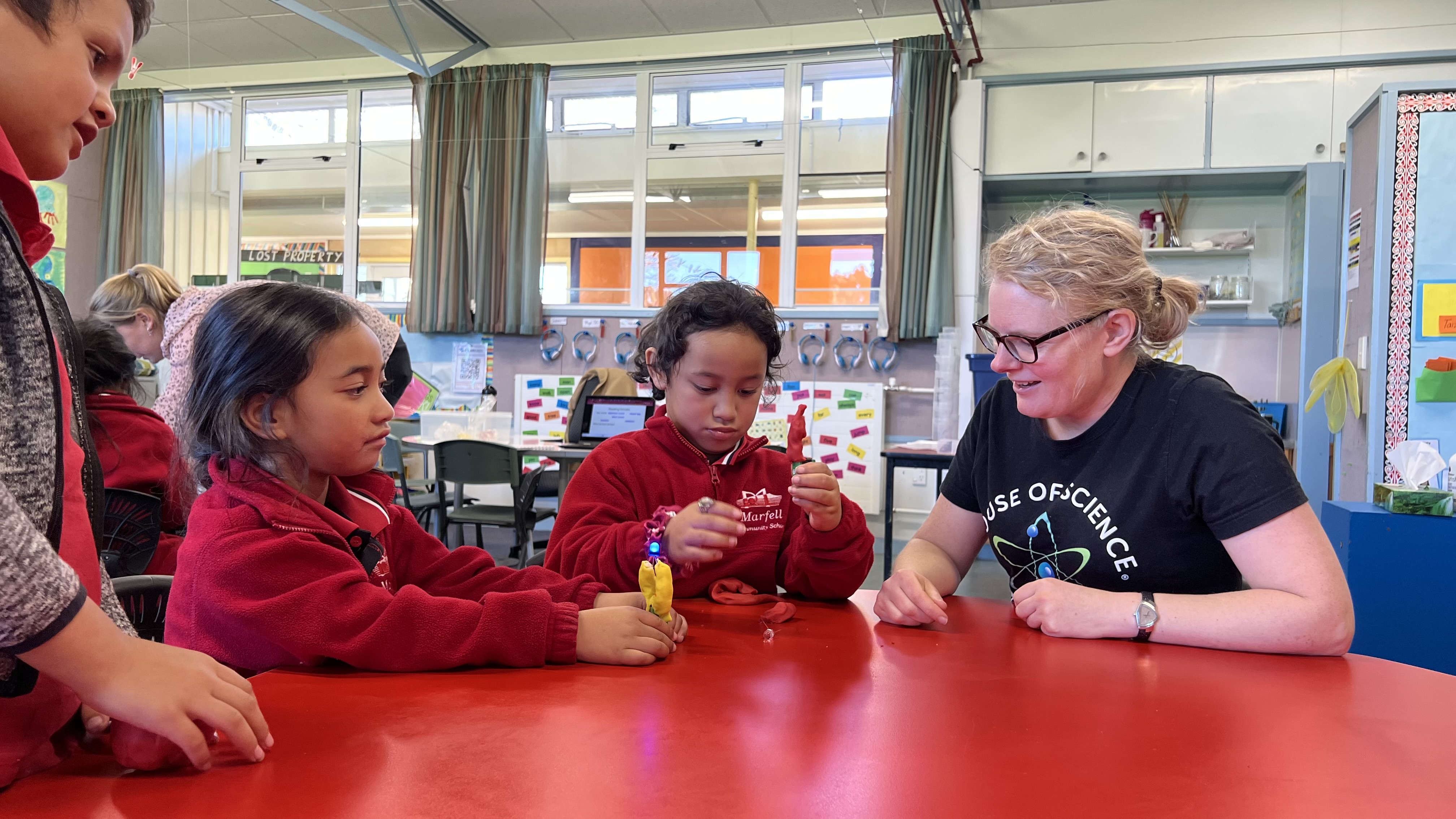 House of Science representative showing students how to make electricity circuits